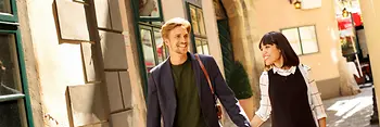 Couple in love goes for a walk in Vienna's Old City