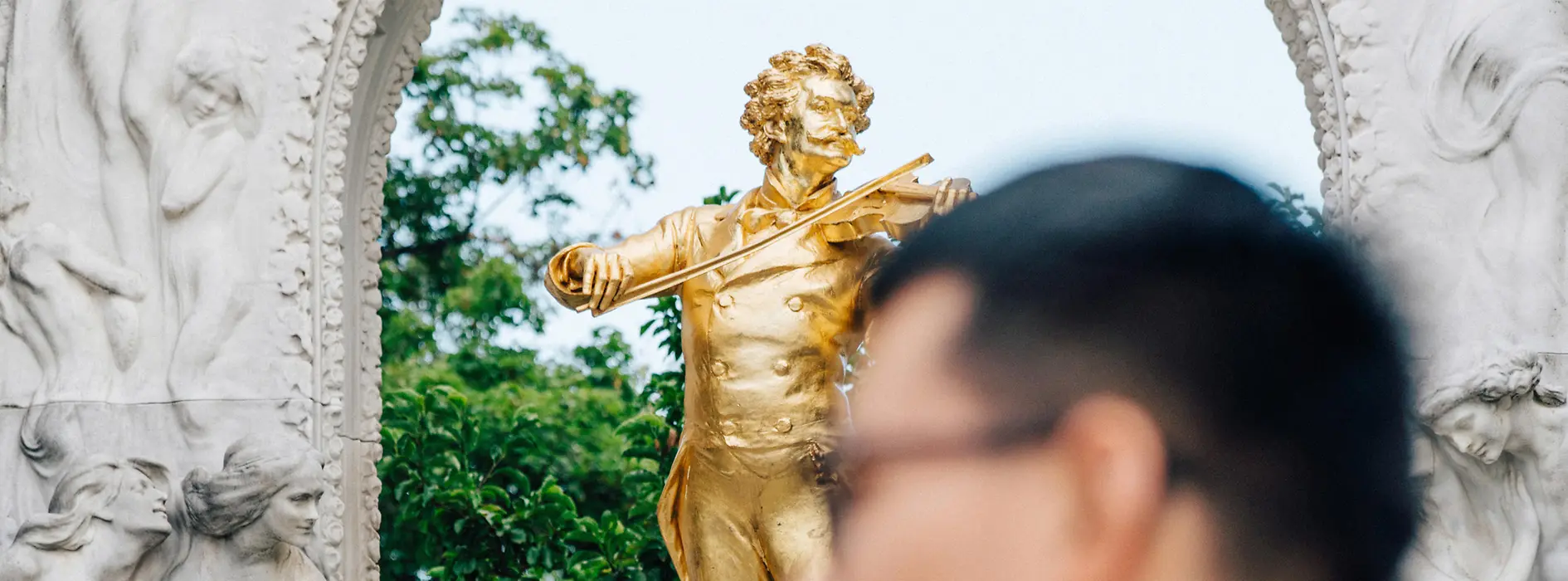 Vienna City Park, Johann Strauss monument, tourists in the foreground