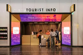 Tourist Info Vienna Airport with travelers asking for information