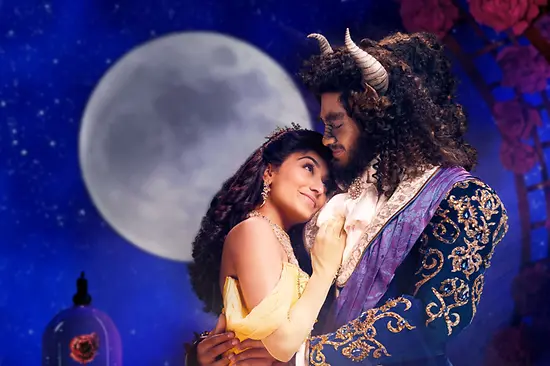 Beauty and the Beast embracing, with the full moon behind them.