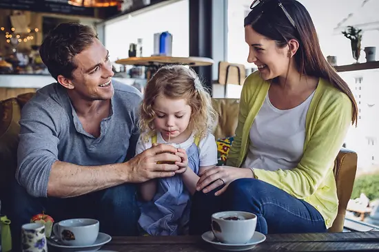 Couple with a child in a restaurant