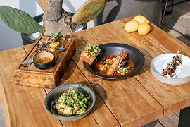 Neni by the water, food on plates