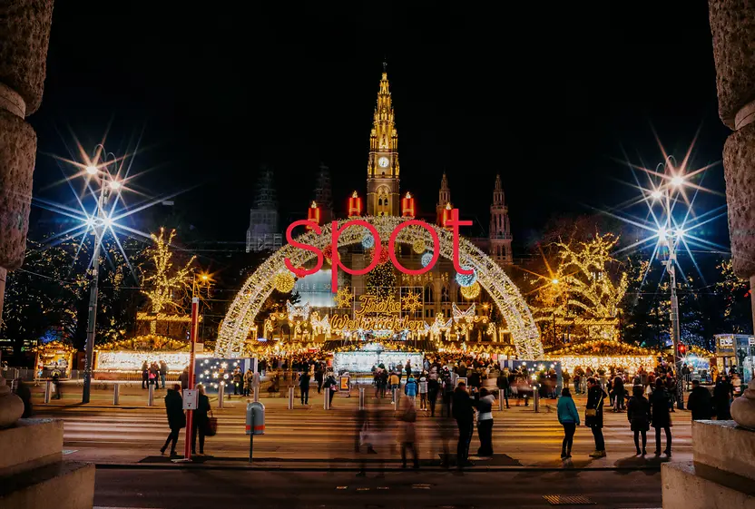 Christmas market at the town hall in the middle of the picture is written “Spot” in red letters