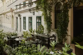 Outdoor dining area at TIAN Bistro restaurant on Spittelberg